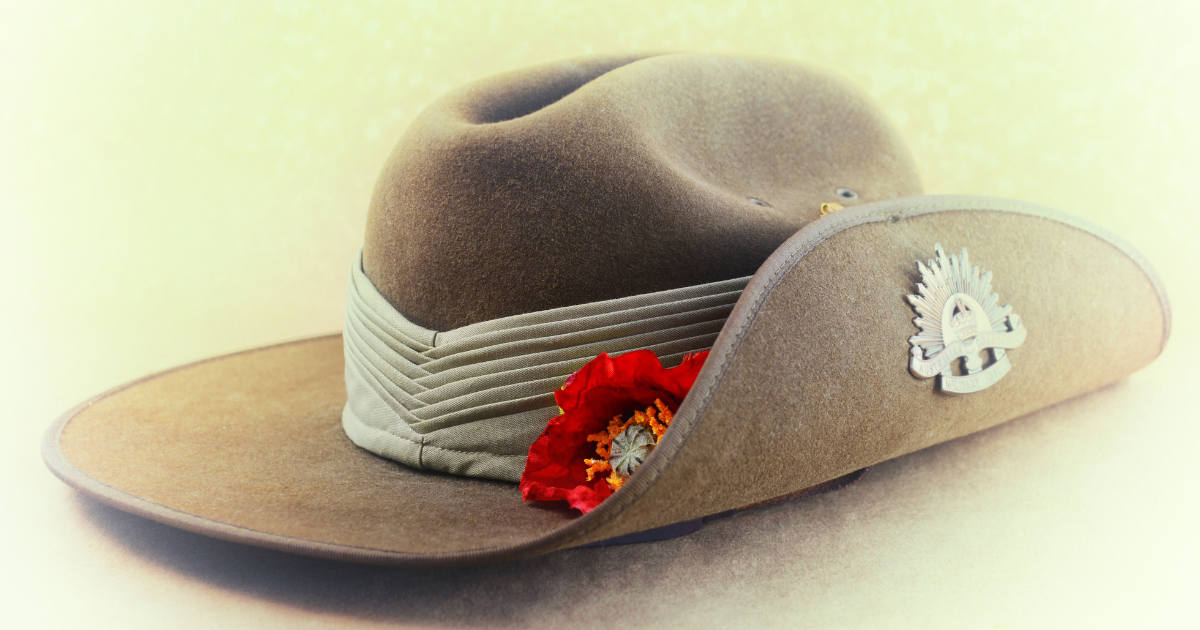 A khaki slouch hat with a red poppy and the Australian Army Corps badge, worn by Australian soldiers.