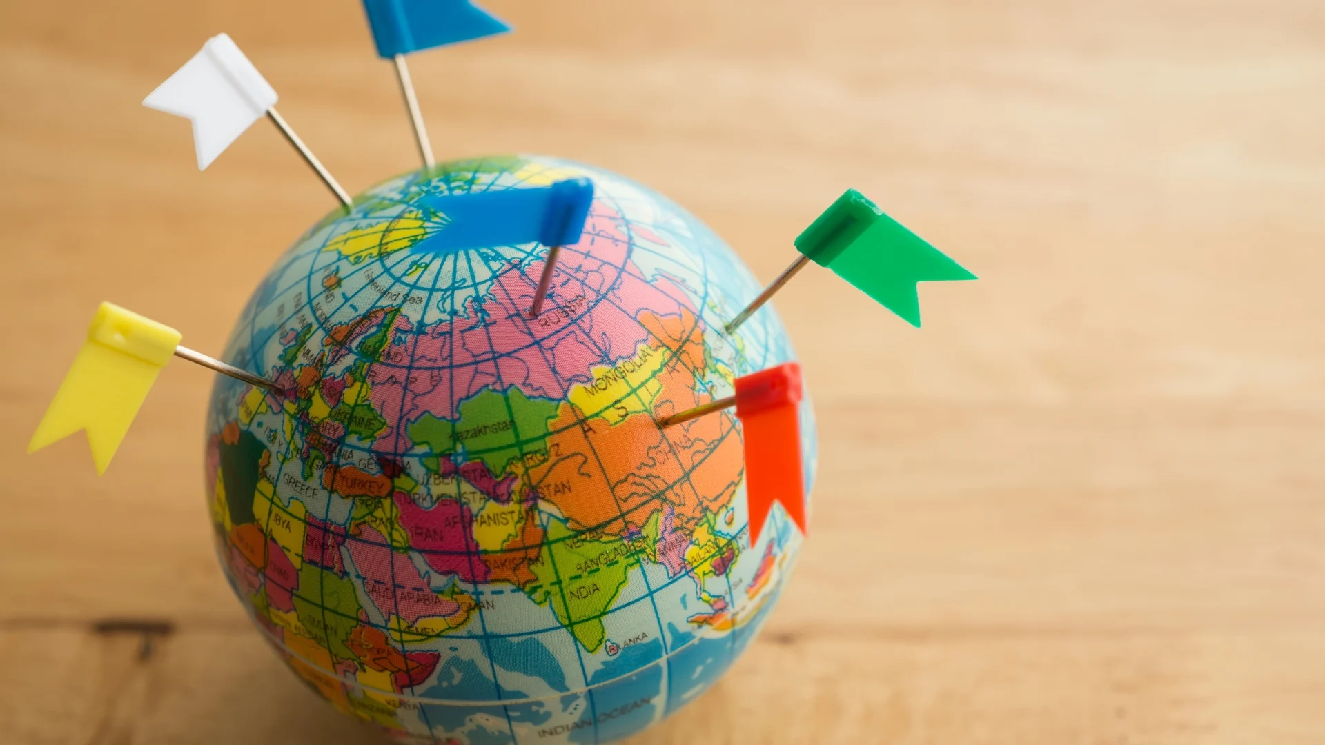 Blog_Exploring-the-World-Together-Our-2024-Journeys-and-2025-Goals_world-with-pins-in