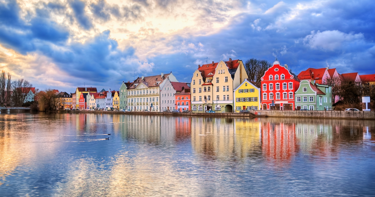 A view of colorful houses lining the Isar River in Landshut, Germany.