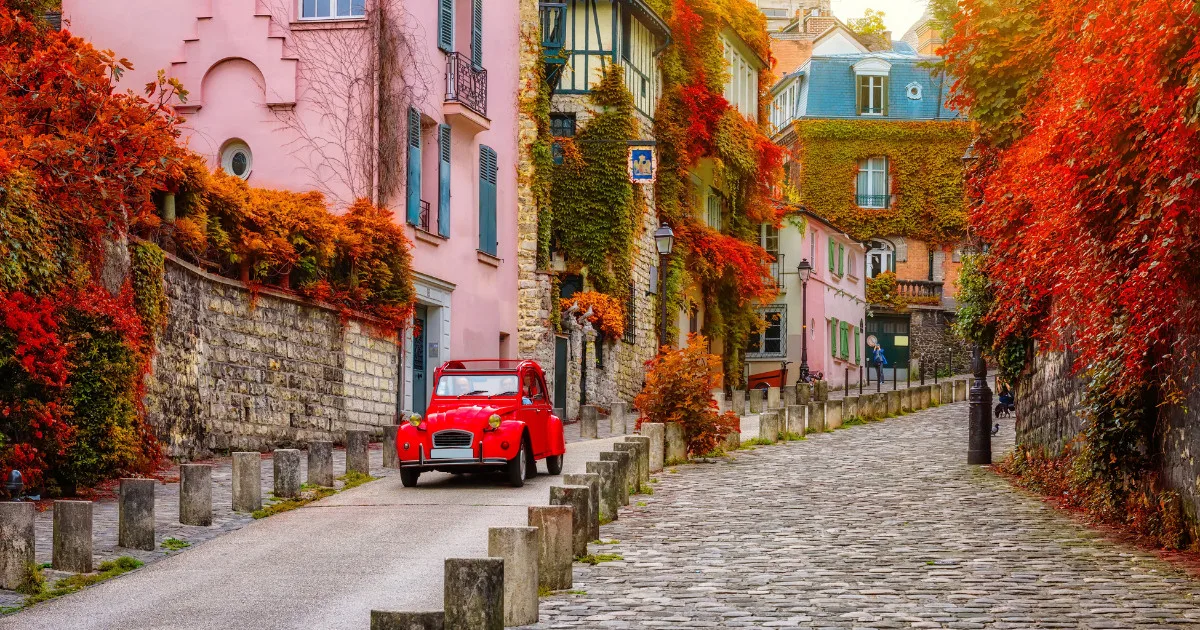 Cozy street in quarter Montmartre in Paris, France. Architecture and landmarks of Paris. Postcard of Paris