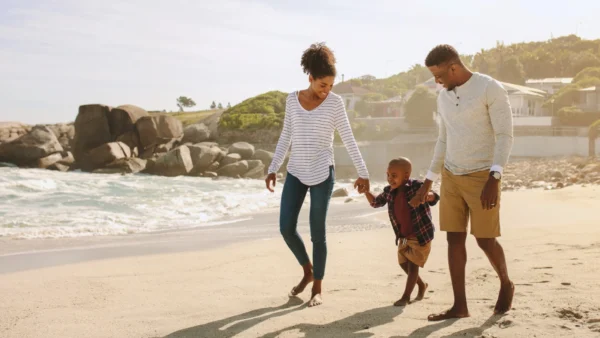 Family of three on a beach