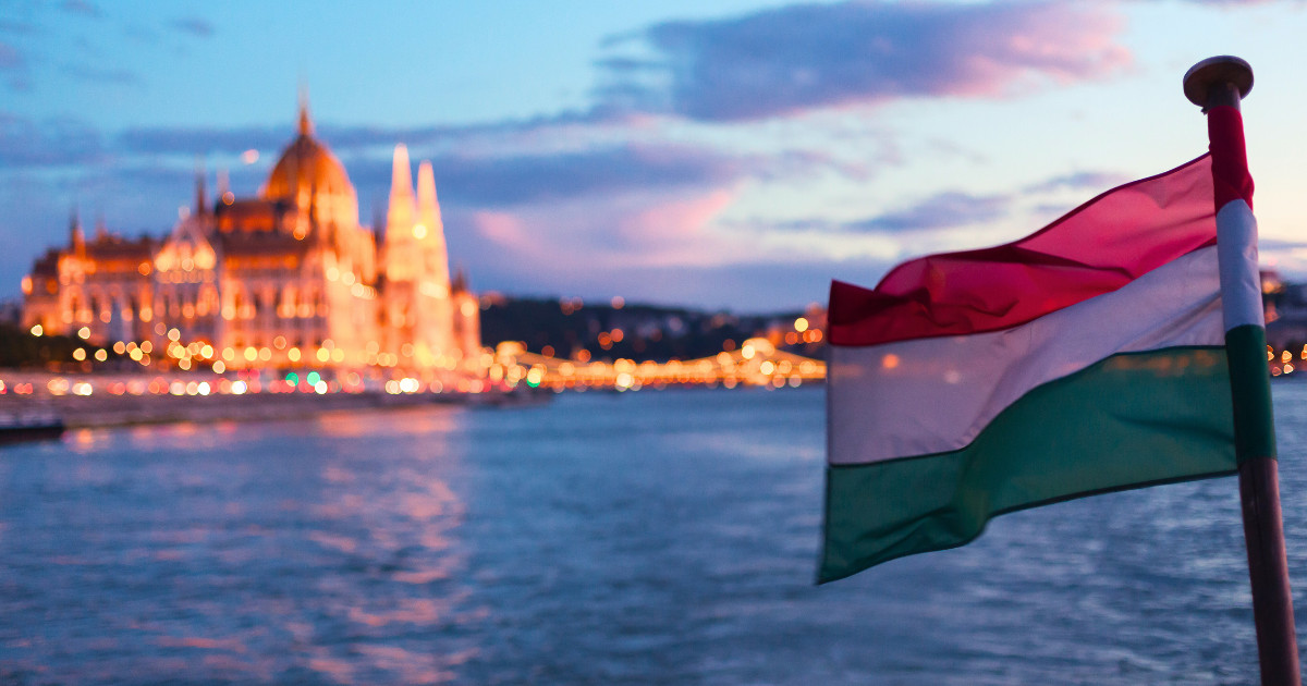 The Hungarian flag and the Parliament Building in Budapest.