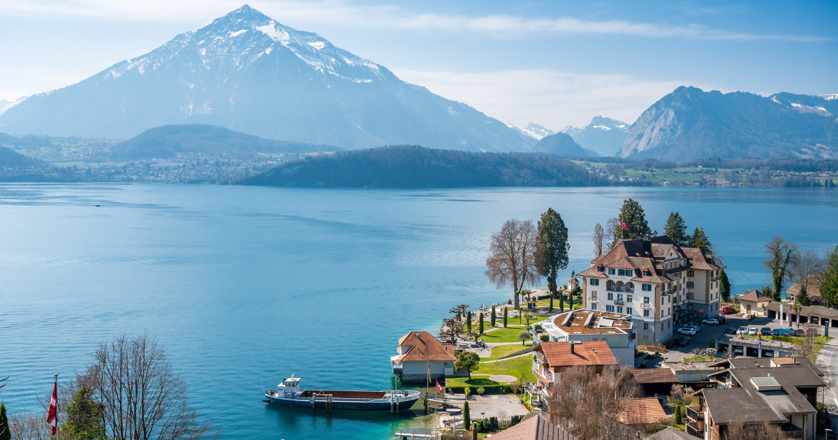 Lake Thun, Niesen and Parkhotel Gunten on a spring day seen from Gunten