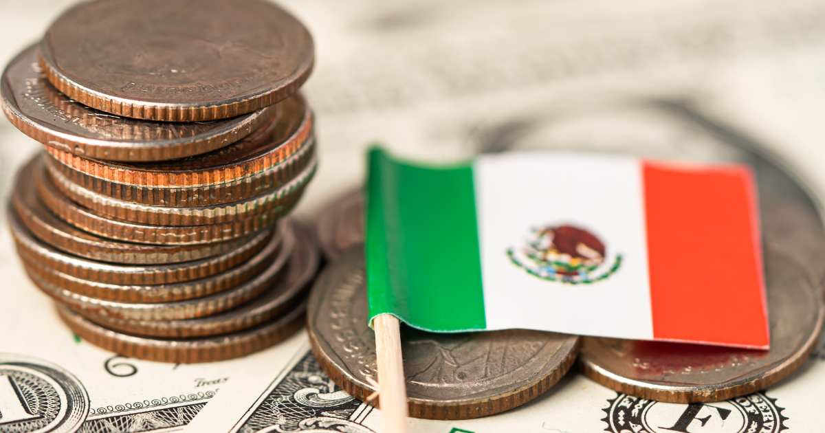 A stack of coins with the Mexican flag.