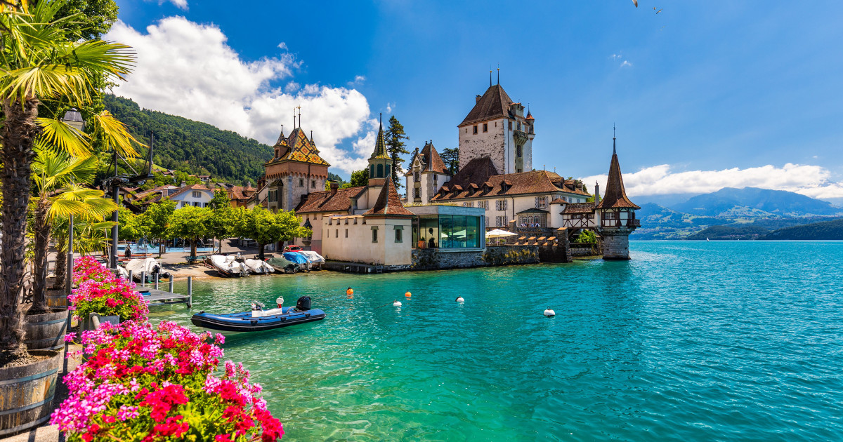 Oberhofen Castle at Lake Thunersee in swiss Alps, Switzerland. Schloss Oberhofen on the Lake Thun (Thunersee) in Bern Canton of Switzerland.