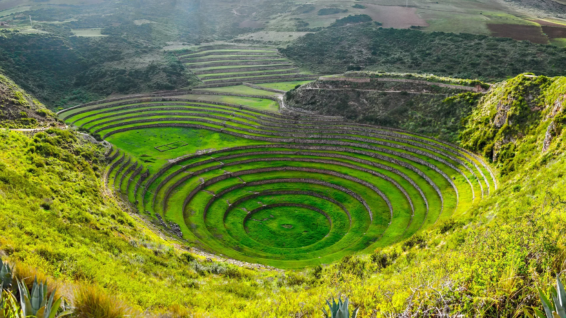 The ancient Incan agricultural terraces of Moray, a circular archaeological site with concentric rings.