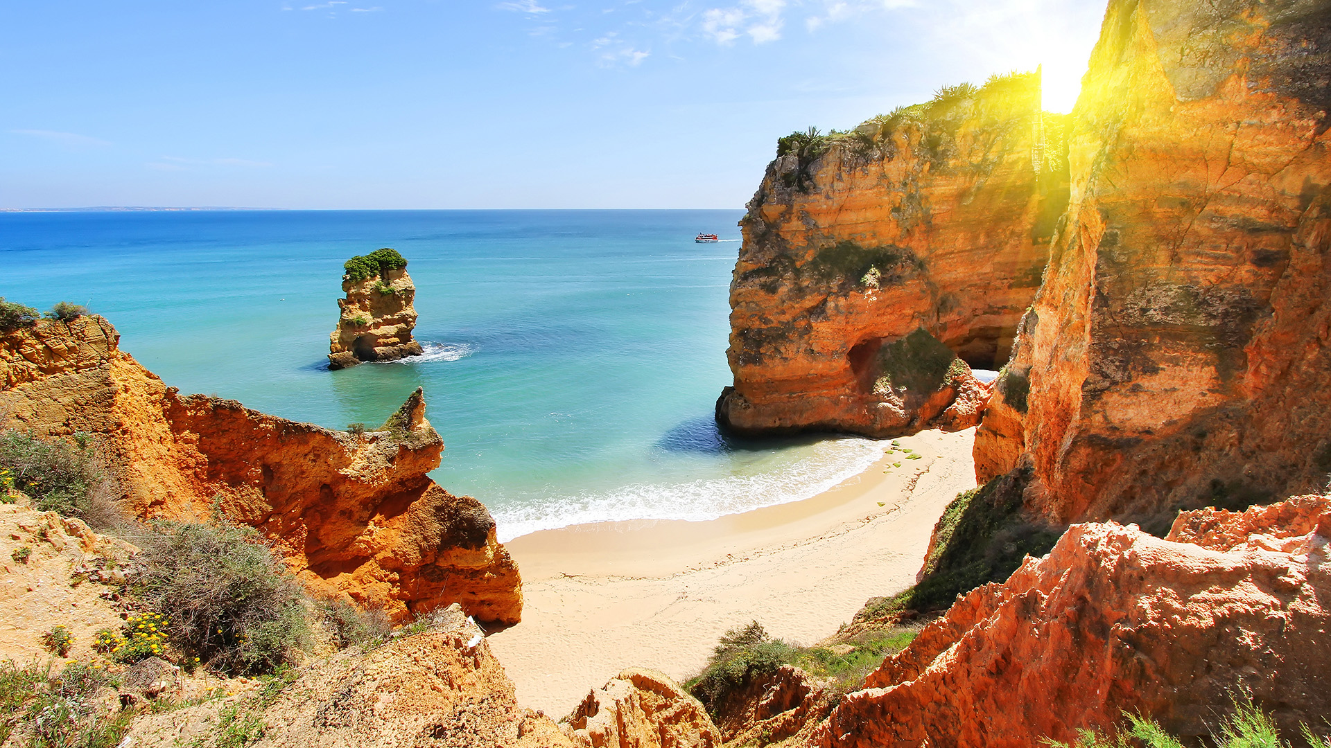 The Algarve coast in Portugal with dramatic rock formations.