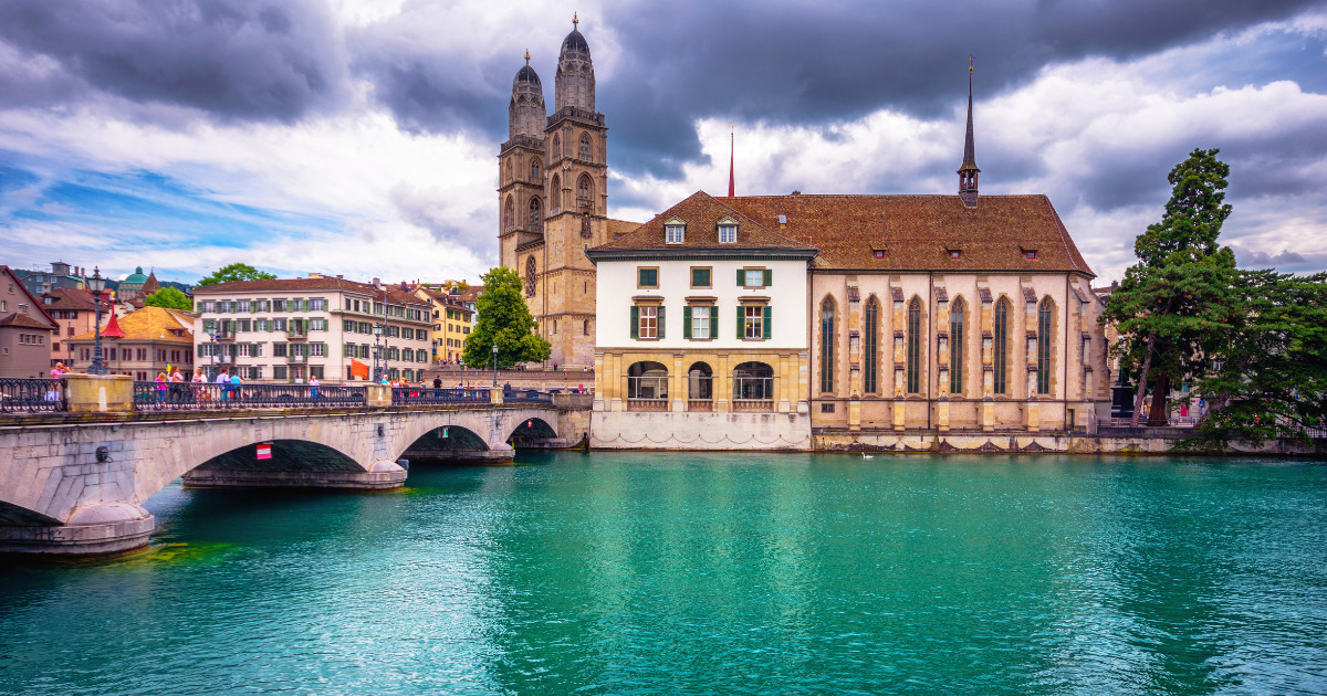 Scenic view of historic Zurich city center with famous Fraumunster and Grossmunster Churches and river Limmat at Lake Zurich, Zurich, Switzerland