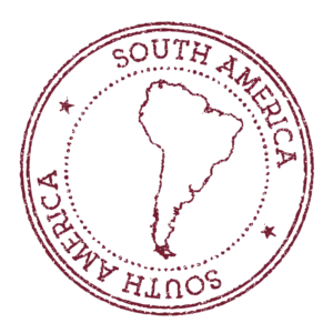 A circular stamp with the outline of South America.