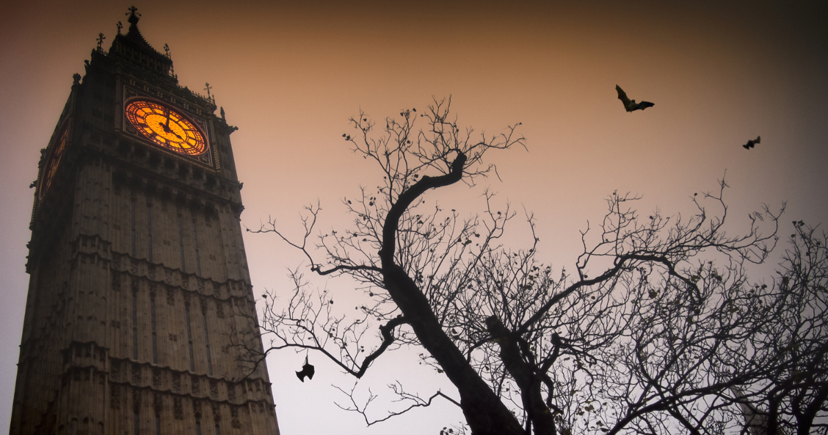 Big Ben with bats flying in front of it, against a spooky, twilight sky.