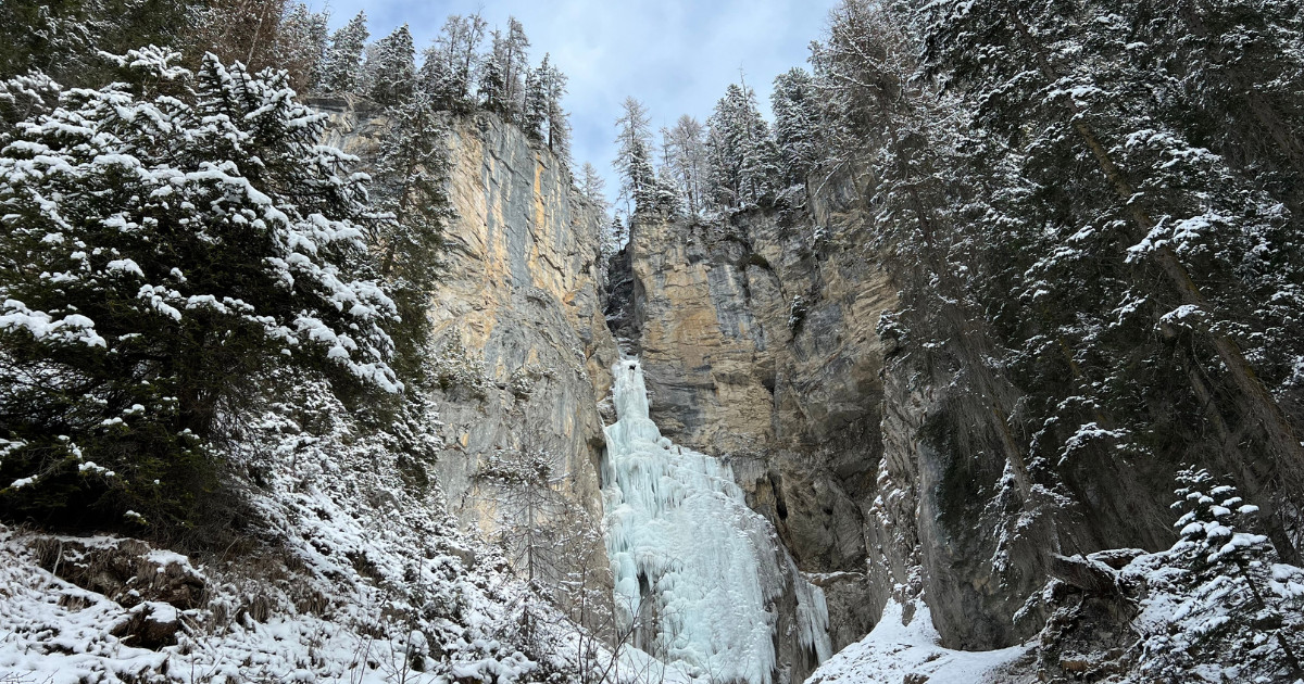 Tiejerbach Eisfall or Tiejer creek icefall (Frozen waterfall on the Tiejer stream) at the foot of the alpine 